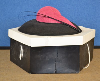 Lot 109 - A deep pink and black straw hat by Whiteley,...