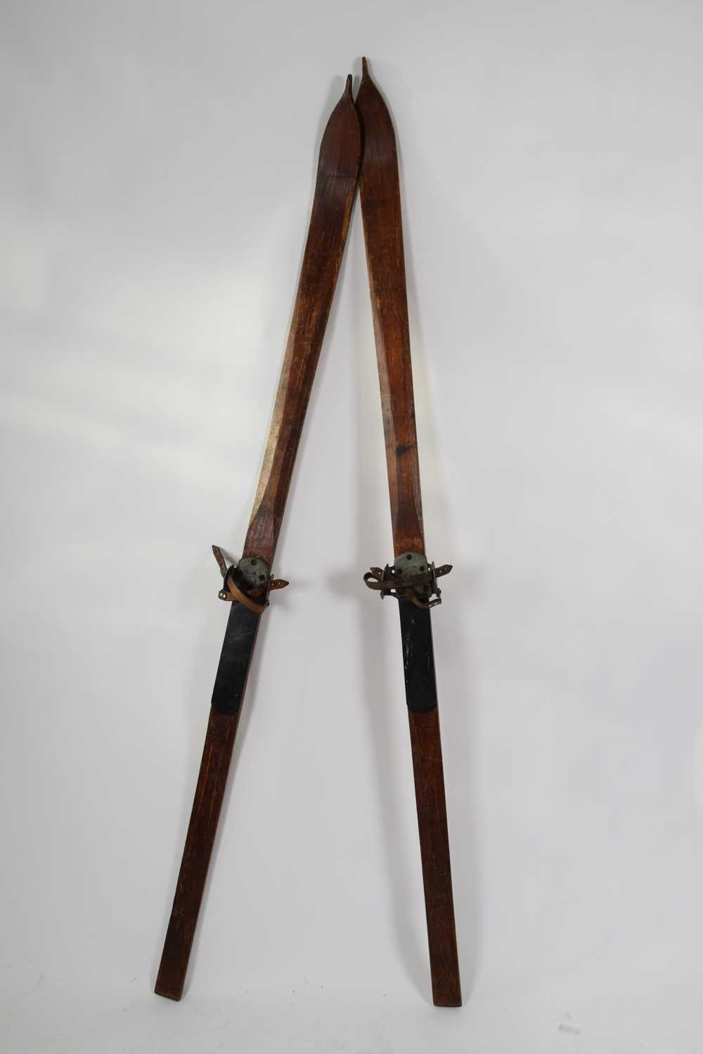 Lot 184 - Pair of vintage wooden skis made by Luck