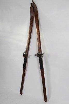 Lot 184 - Pair of vintage wooden skis made by Luck