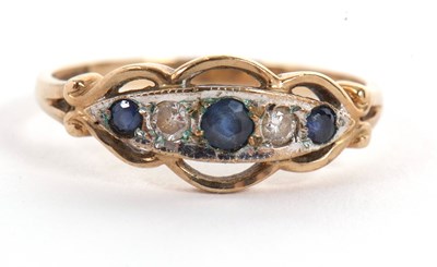 Lot 59 - A 9ct sapphire and diamond ring, the graduated,...