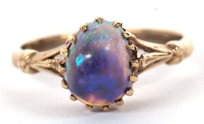 Lot 37 - A 9k opal ring, the oval opal cabochon, claw...