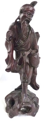 Lot 283 - A Chinese wooden carving of an immortal, 34cm...