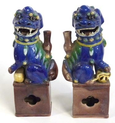 Lot 300 - A pair of Chinese dogs of fo on brown...