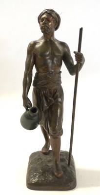 Lot 519 - Spelter model of a tribesman, indistinctly...