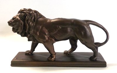 Lot 345 - A metal model of a lion on rectangular base...