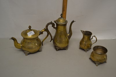 Lot 136 - A brass teapot, coffee pot, milk jug and sugar...