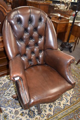 Lot 561 - A 20th Century brown leather upholstered...