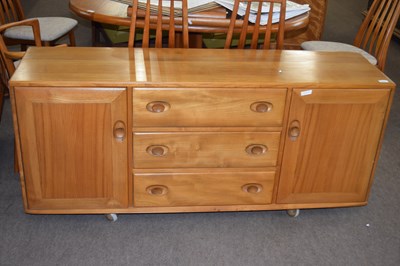 Lot 584 - Ercol light elm sideboard with two doors and...