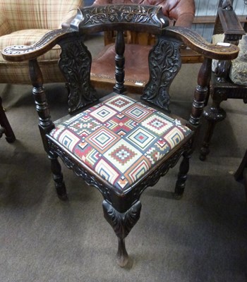 Lot 611 - A Victorian gothic carved oak corner chair,...