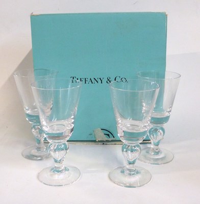 Lot 468 - Four Tiffany wine goblets on baluster tear...