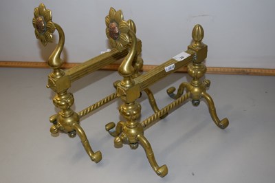 Lot 26 - A pair of brass fire dogs with floral decoration