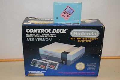 Lot 41 - Nintendo NES control deck together with a...