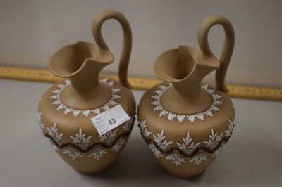 Lot 43 - A pair of Doulton Lambeth silicon ware jugs