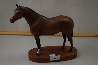 Lot 51 - A Beswick model of a thoroughbred racehorse on...