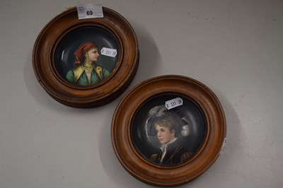 Lot 69 - A pair of small painted saucers mounted in...