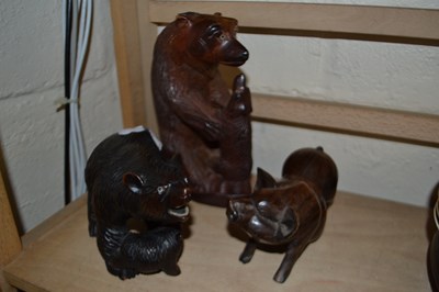 Lot 503 - Two carved model bears and a pig (3)