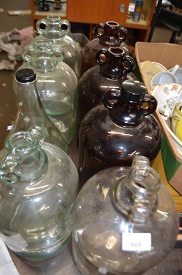 Lot 668 - Seven demijohns and a Taunton cider bottle (8)