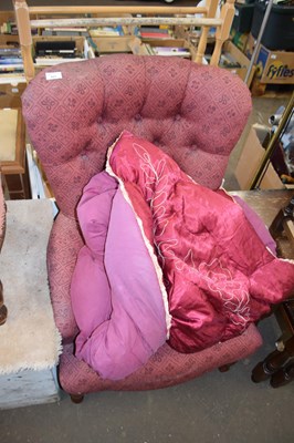 Lot 827 - Pink cloth button back armchair with wooden...