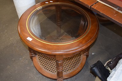 Lot 856 - Circular coffee table with cane bottom tier