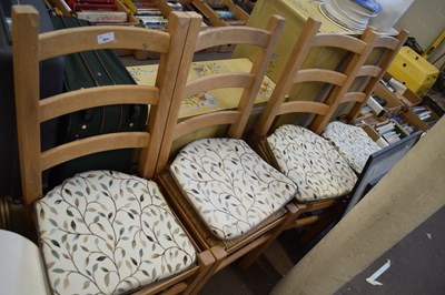 Lot 864 - Four pine chairs with cushions and straw seats