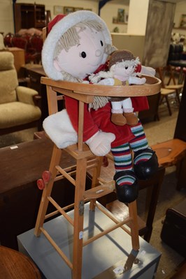 Lot 341 - Dolls in a high chair