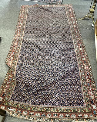 Lot 690 - Persian rug with central leaf design panel in...