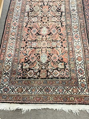 Lot 625 - Persian runner carpet with floral pattern...