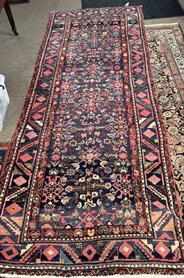 Lot 688 - Persian runner carpet with blue and red...