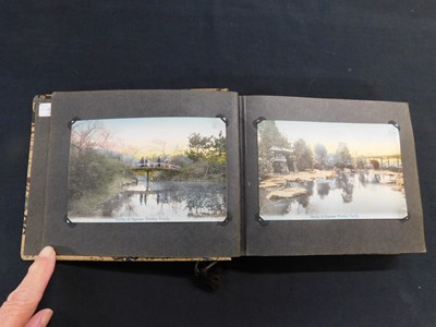 Lot 330 - Japanese card album containing 48 hand tinted...