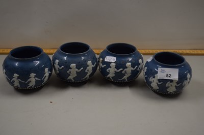 Lot 52 - A set of four small Doulton circular vases...