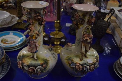 Lot 158 - Pair of figural and floral encrusted vases of...