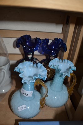 Lot 672 - Pair of pale blue glass jugs and a pair of...