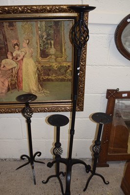 Lot 336 - Four iron floor standing candle holders