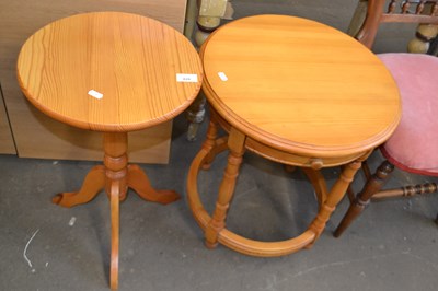 Lot 828 - Three legged round pine side table together...