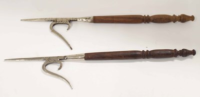 Lot 42 - Pair of nickel plated pike heads on small...