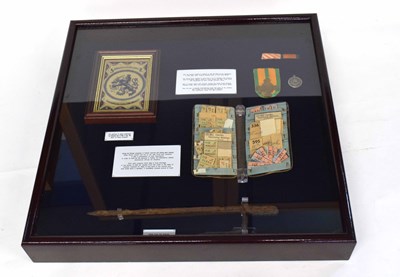 Lot 75 - WWII display case with items from German...