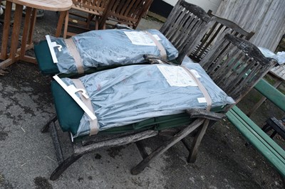 Lot 141 - Pair of reclining garden chairs with covers