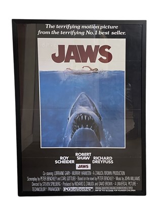 Lot 162 - A framed and glazed poster for JAWS (1975...