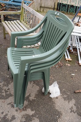 Lot 148 - Set of four green plastic garden chairs