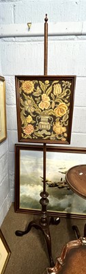 Lot 581 - Needlework pole screen set with a centre panel...