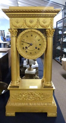 Lot 405 - A French Empire style gilt mantel clock with...