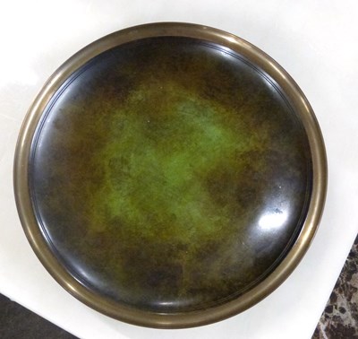 Lot 408 - A bronzed effect metal tray, 23cm diameter