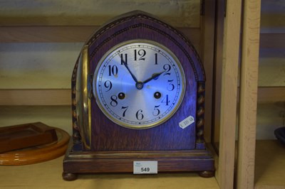 Lot 549 - A wooden mantel clock