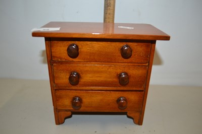 Lot 58 - An Apprentice type three drawer table top chest