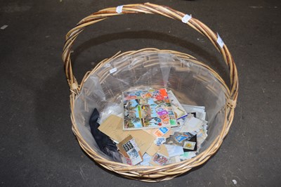 Lot 632 - Wicker basket and a quantity of stamps