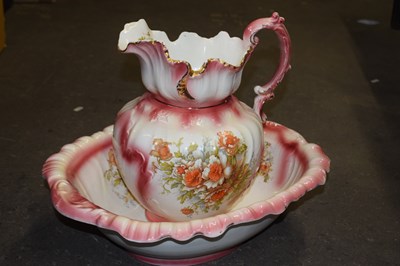 Lot 651 - Pink and floral decorated wash jug and basin