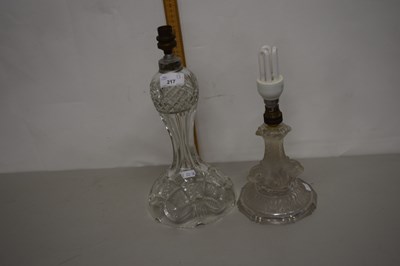 Lot 217 - Two cut glass table lamps, one with a stem...