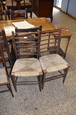 Lot 275 - A pair of rush seat and ladder back side chairs