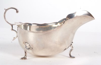 Lot 28 - A George V silver sauce boat of typical form...