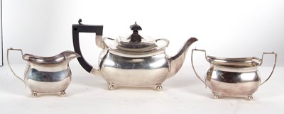 Lot 29 - A matched three piece tea service of plain...